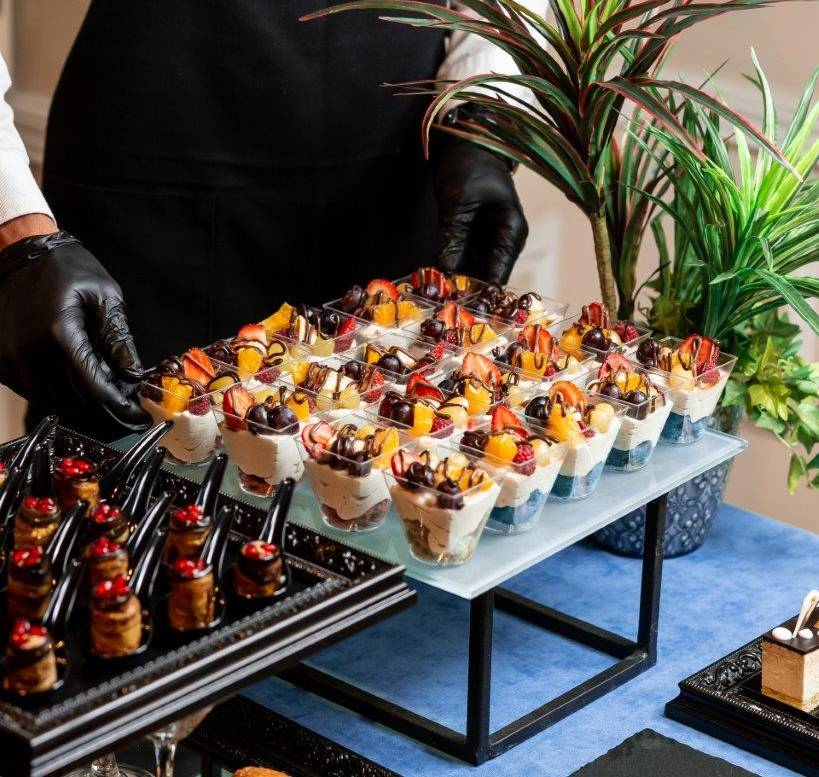 cup-dessert-with-whipped-cream-strawberries-cherries-orange